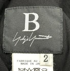 YOHJI YAMAMOTO JAPAN. Black Sleeveless Asymmetrical Drape Cupro Dress