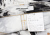 COMME des GARCONS JAPAN. JUNYA WATANABE White, Charcoal, Black Denim Bleach Printed Stretch Slim Pants
