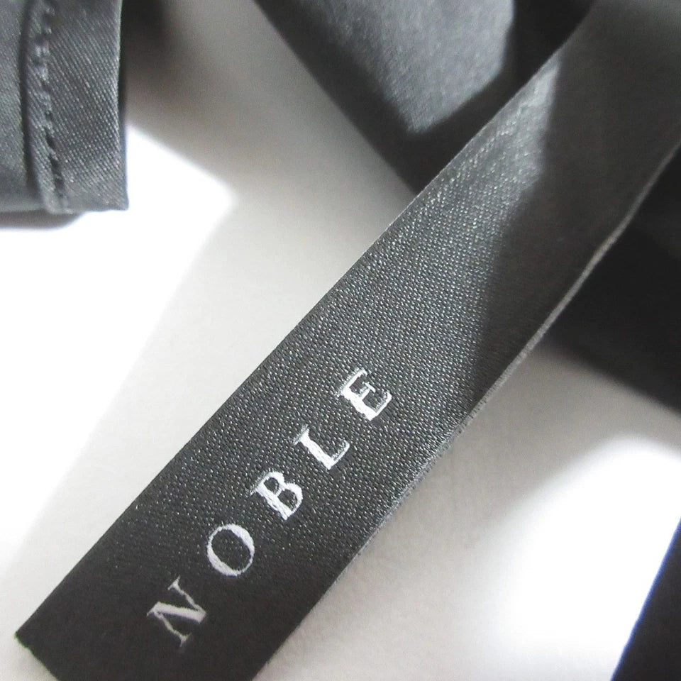 NOBLE JAPAN. 24SS COLLECTION. Black Taffeta Back Open Peplum Blouse